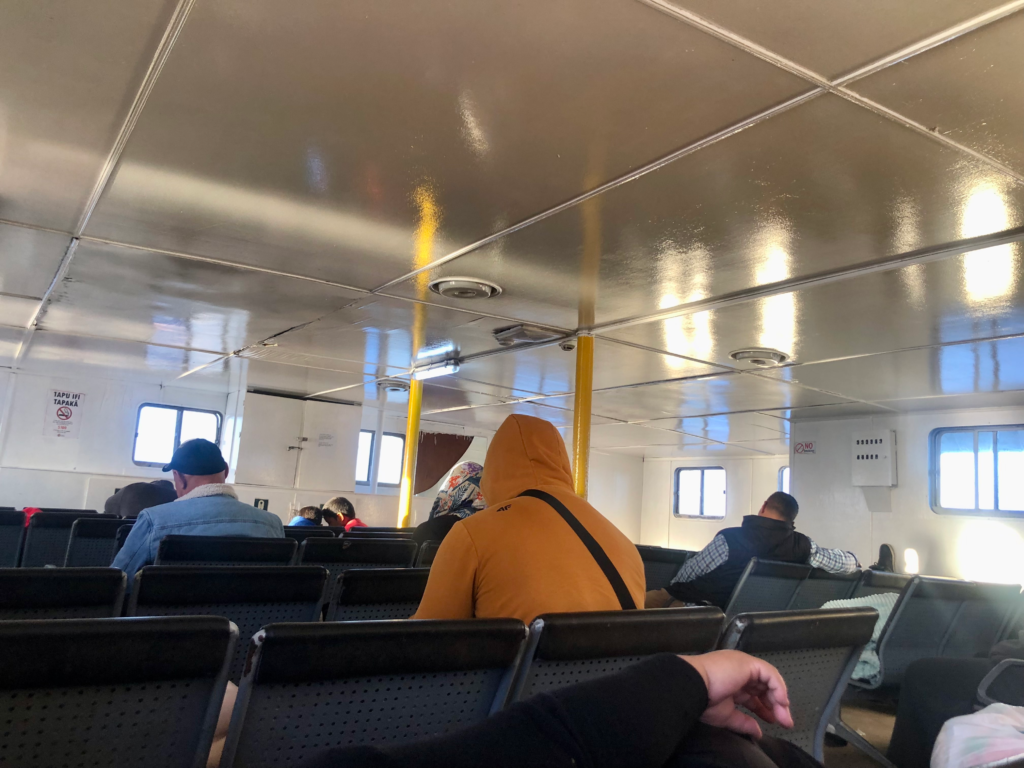 inside the ferry to 'Eua, people sleeping on benches and chairs