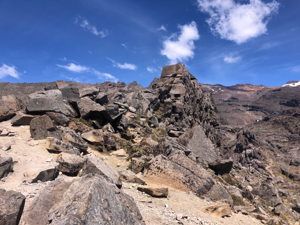 7 day new zealand north island road trip, meads wall. Blue skies and a volcanic landscape of sharp rocks