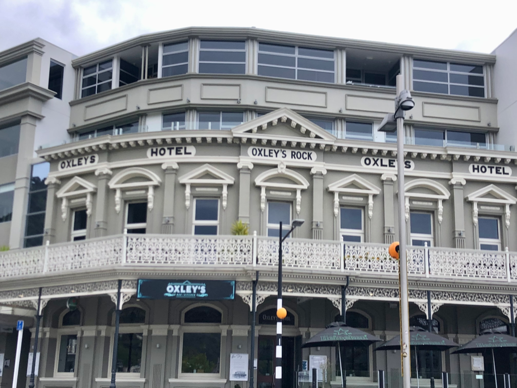 gray building with intricate windowsill designs in Picton , NZ restaurant "the oxley"