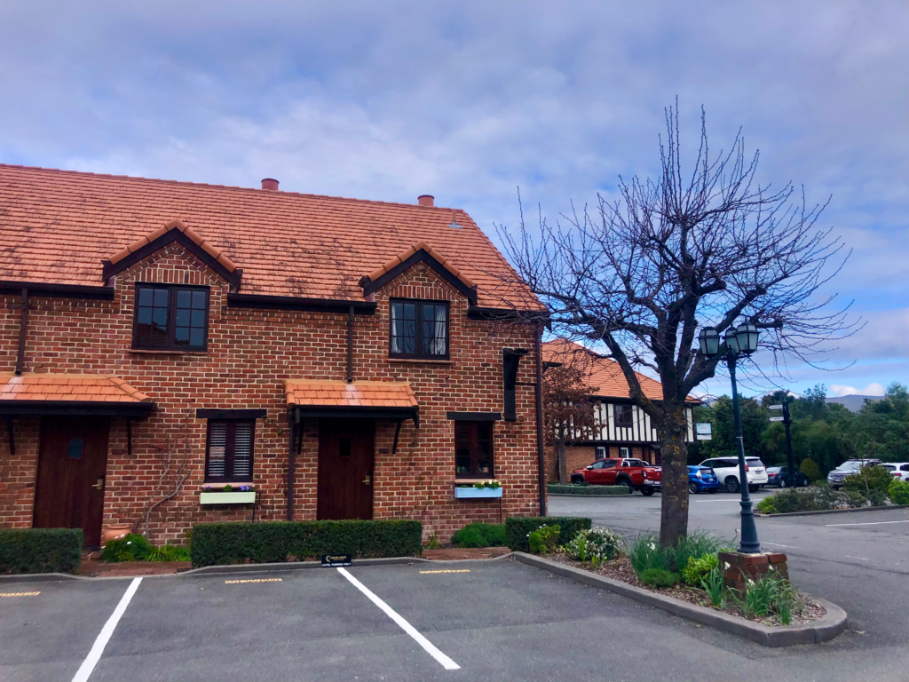 how to spend 2 days in nelson. photo of the grand arden hotel in nelson. brick building in parking lot