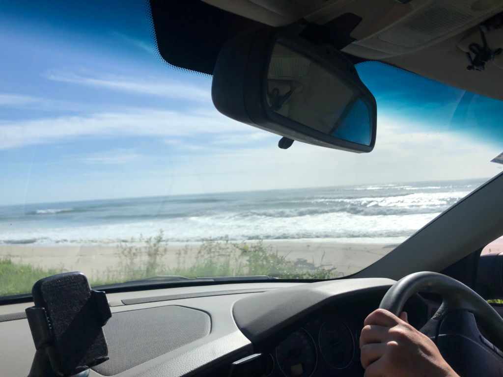 view of beach through car windshield