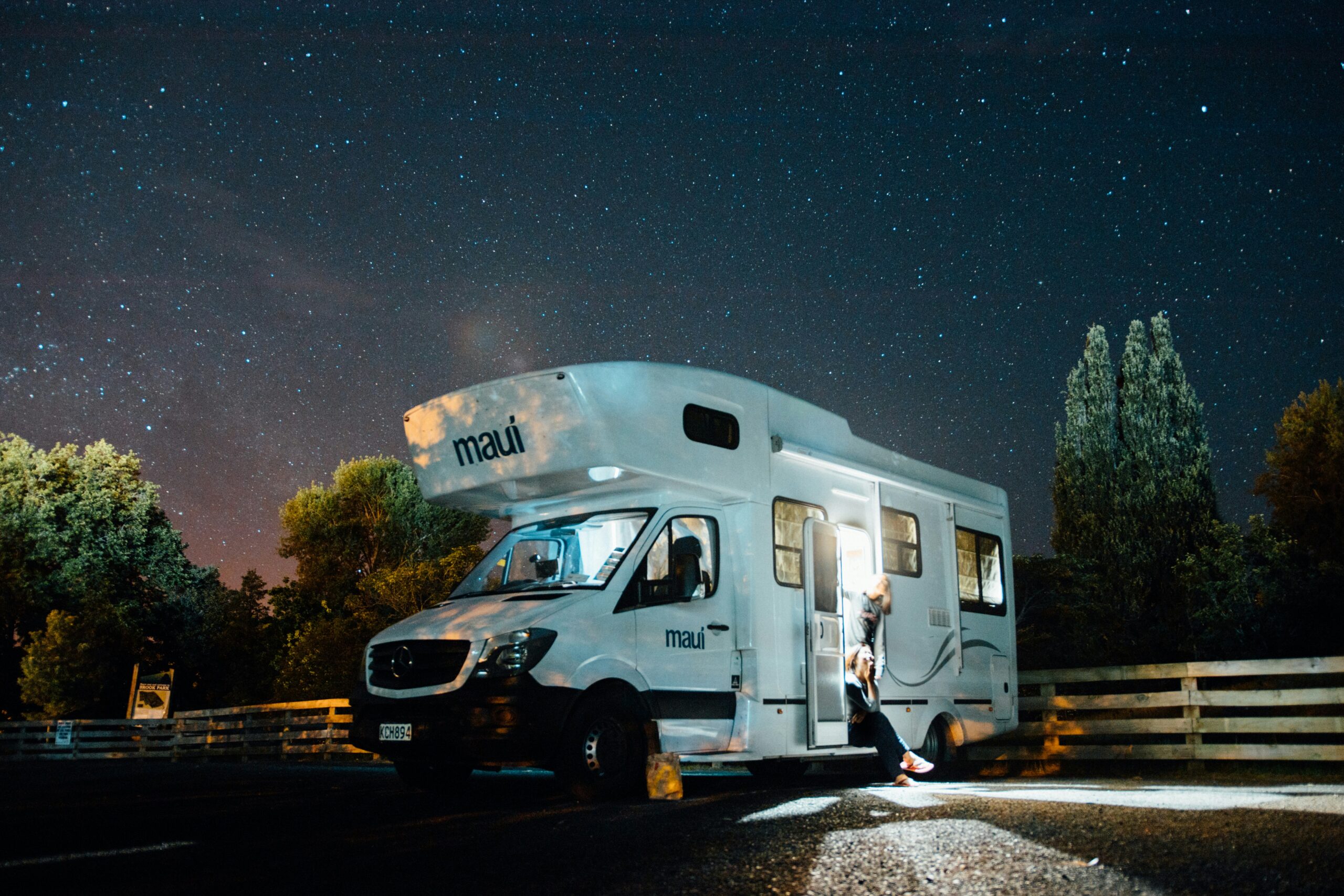 moterhome van beneath stars